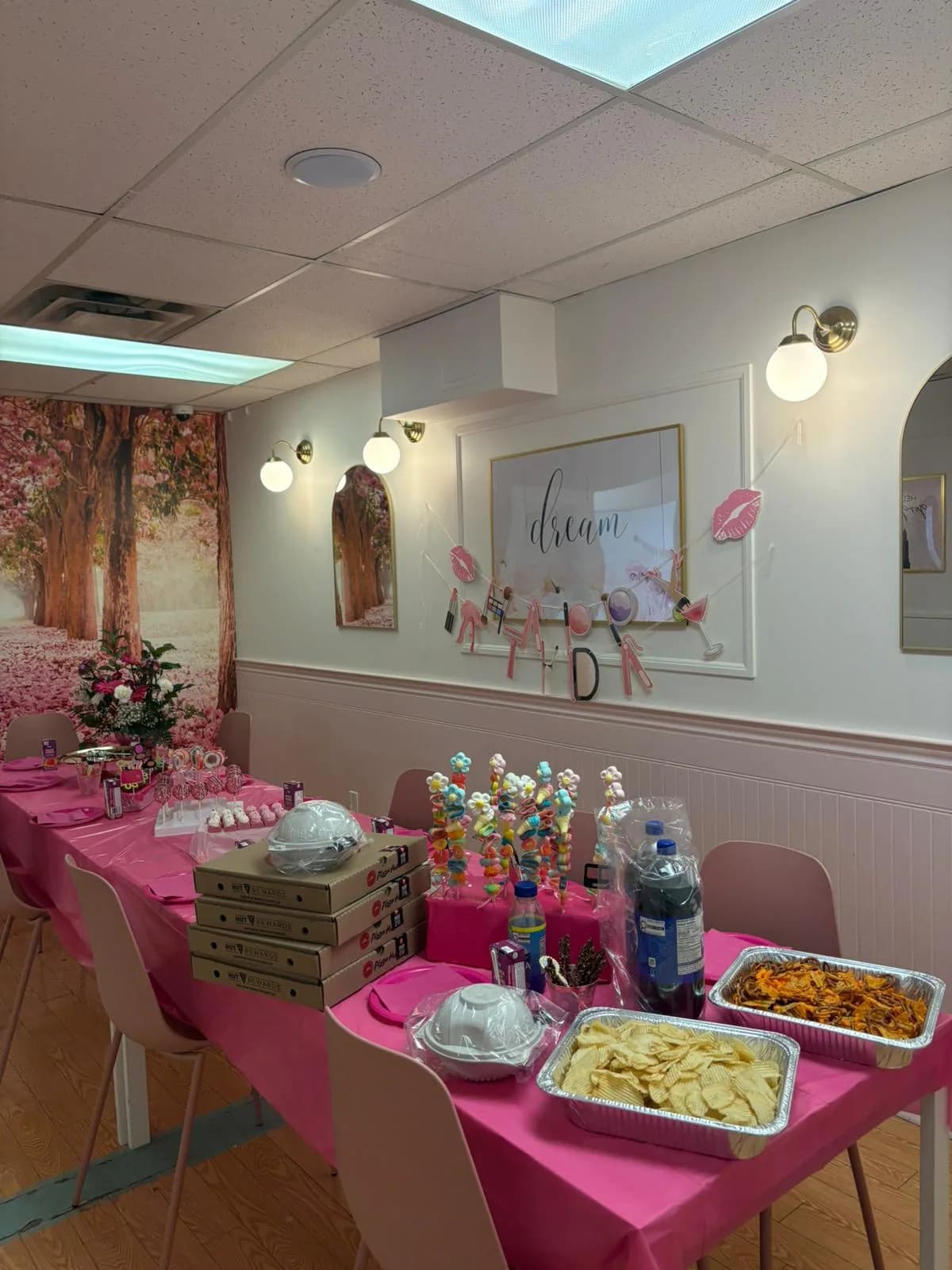 A pink party table set in Hily's Sparkly Spa