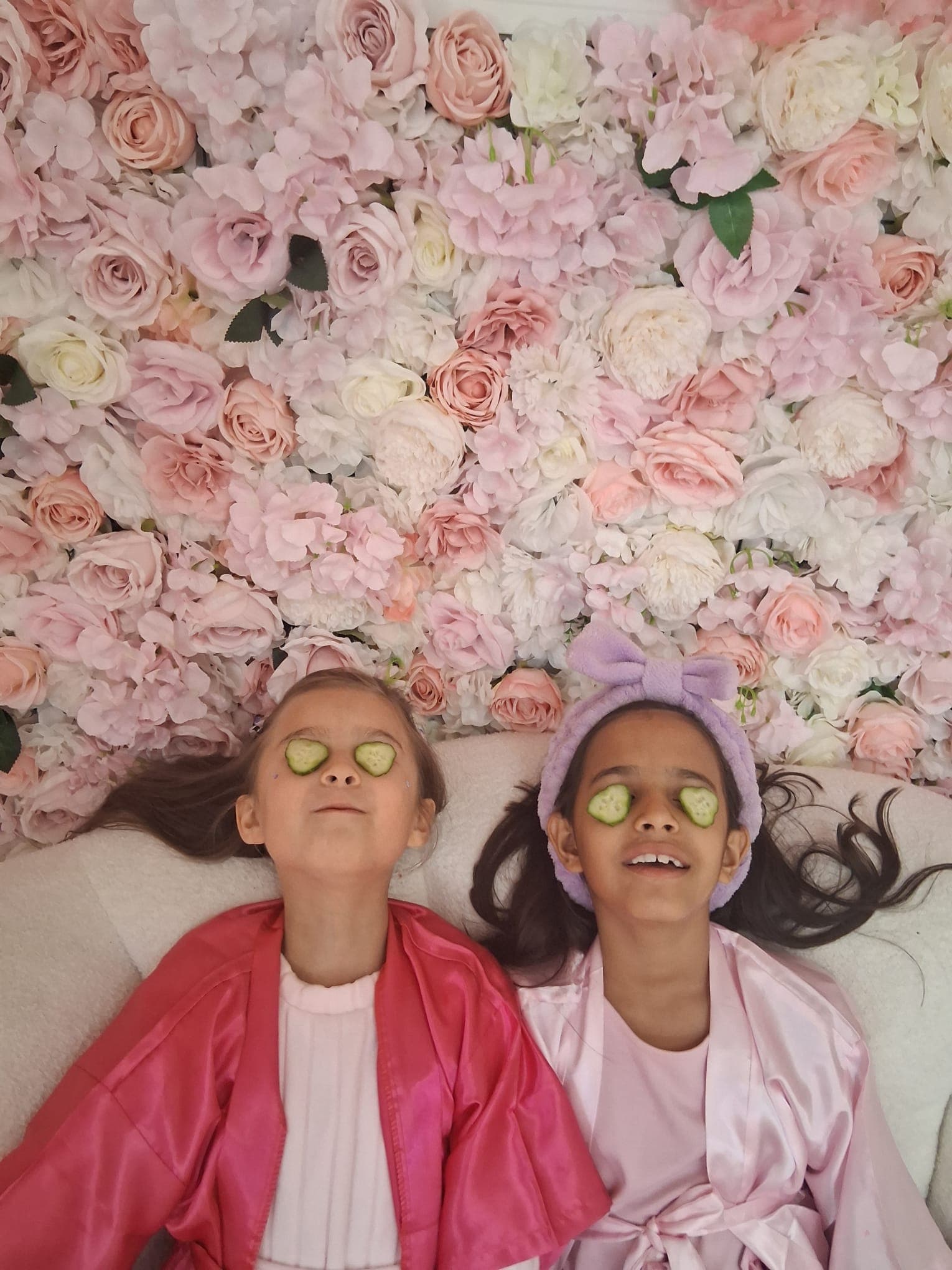 Two young guests enjoying a cucumber-eye spa moment at Hily's