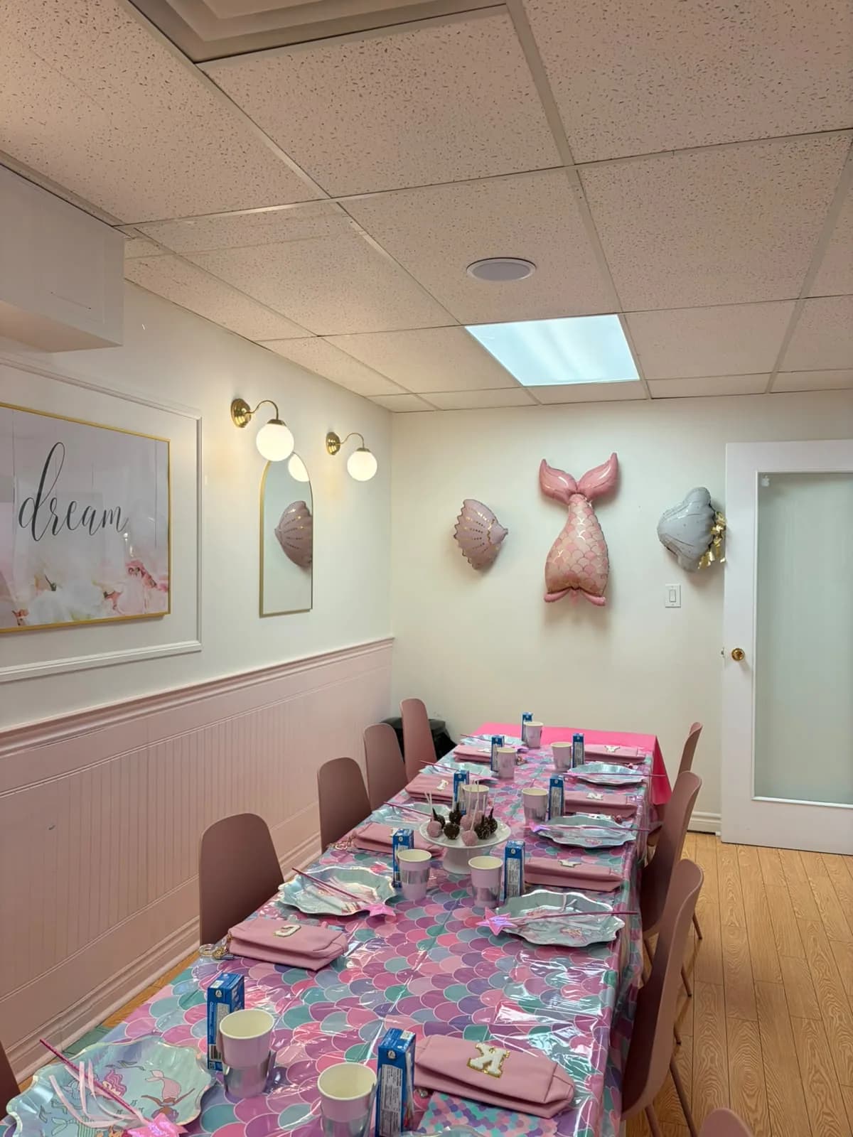 A mermaid-themed birthday table prepared for guests at Hily's